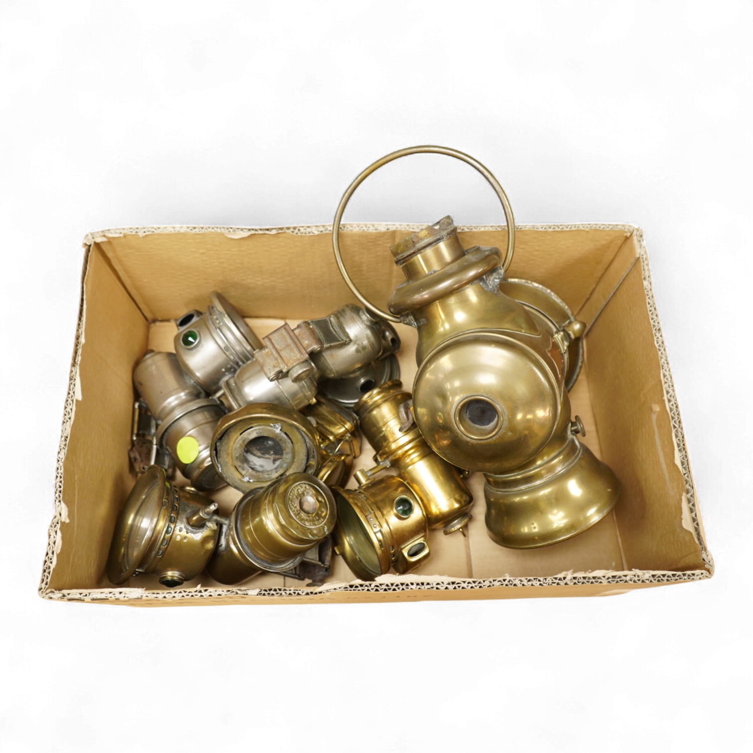 An early 20th century Lucas ‘King of the Road’ brass carriage lamp, 35cm high, together with five brass motorcycle lamps by Lucas, etc.